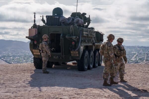 Photo: US Army soldiers are outside a Stryker armored infantry